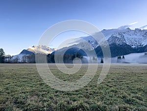 Farmland view of the Cascade mountains in Washington state during early winter season