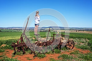 Farmlands views for miles from rusting farm tiller