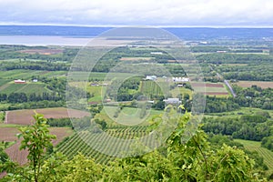 Farms stretching across landscape of Annapolis Valley with the Bay of Fundy on the horizon