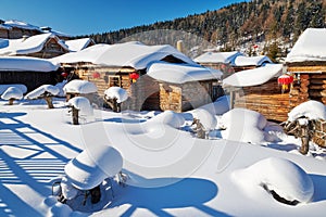 The farmyards in white snow and blue sky photo