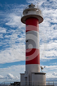 Faro de Fuelcaliente, red-white lighthouse tower on south of La Palma siland, Canary, Spain photo
