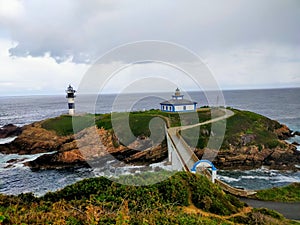 Faro de Isla Pancha se encuentra en la Isla Pancha, en la parte mÃ¡s occidental de la RÃ­a de Ribadeo photo