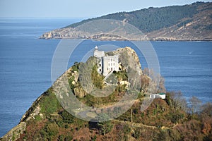 The Faro de la Plata Llighthouse and Cantabrian Sea. Monte Ulia, Pasaia, Gipuzkoa, Basque country, Spain photo