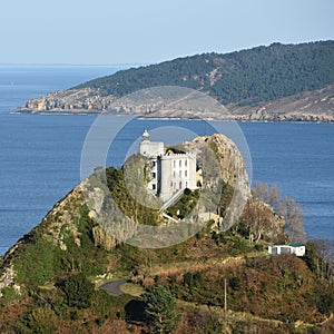 The Faro de la Plata Llighthouse and Cantabrian Sea. Monte Ulia, Pasaia, Gipuzkoa, Basque country, Spain photo