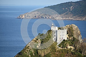 The Faro de la Plata Llighthouse and Cantabrian Sea. Monte Ulia, Pasaia, Gipuzkoa, Basque country, Spain photo