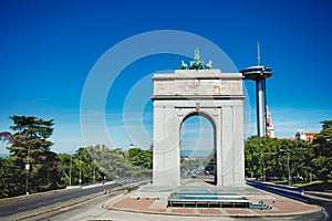 Faro de Moncloa transmission tower and Arch of Victory in Madrid photo