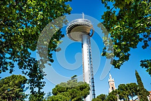 Faro de Moncloa transmission tower over museum of the Americas photo