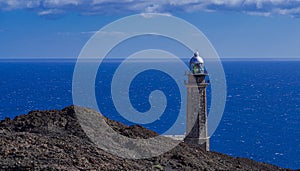 Faro de Orchilla lighthouse, with volcanic rocks and Alantic ocean landscape