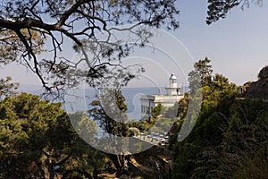 Faro  Lighthouse  of Portofino with outdoor cafe, bar. with a sea view.