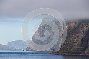 Faroe island misty cliffs