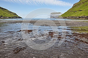 Faroe islands beach in Tjornuvik. Rising og kelling stacks