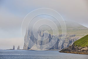 Faroe islands coastline cliffs landscape. Rising og kelling stacks