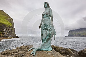 Faroe islands fjord coastline landscape in Kalsoy. Mikladalur mermaid photo