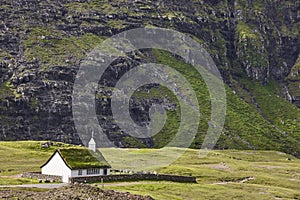 Faroe islands green landscape. Saksun village with picturesque church