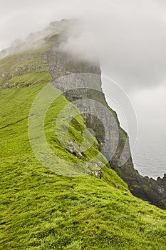 Faroe islands landscape with cliffs and atlantic ocean. Mikladalur, Kalsoy