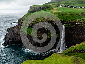 Faroe Islands. MÃÂºlafossur Waterfall. Vertical. photo