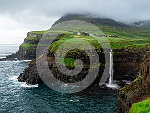 Faroe Islands. MÃÂºlafossur Waterfall. photo