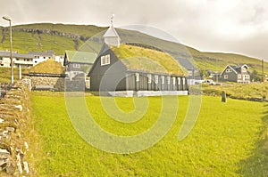 Faroese wooden church standing close to the coast in Kollafjørður.
