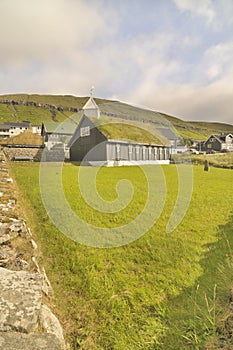 Faroese wooden church standing close to the coast in Kollafjørður.