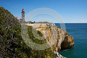 Farol de Alfanzina Lighthouse landscape in Algarve, Portugal