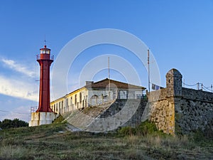 The Farol de Esposende Esposende Lighthouse set in front of the Fort of Sao Joao Baptista de Esposende photo