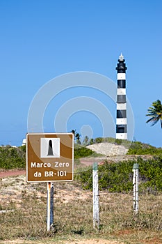 The Calcanhar Lighthouse and the beginning of the BR-101, the largest highway in Brazil. photo