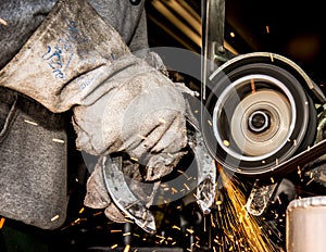 Farrier grinding horseshoe