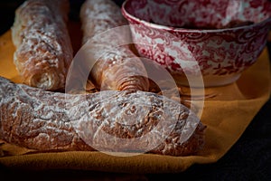 Fartons, typical pastries from Valencia, Spain, with hot chocolate. A sweet breakfast or snack