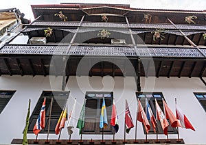 Fascade Of White Building with Many Different Countries Flags in Stone Town, the Capital of Zanzibar