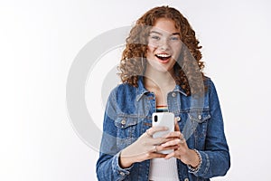 Fascinated good-looking charismatic redhead girl curly hair say cheeze taking shot you capturing image using smartphone