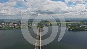 Fascinating landscape of wide river dividing city on two parts on summer day