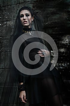 Fashiom model dressed in gothic style. Vamp.