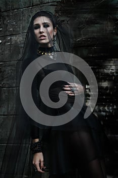 Fashiom model dressed in gothic style. Vamp. photo