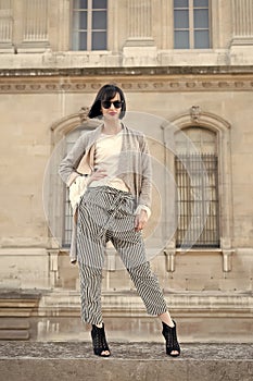 Fashion, accessory, vogue. Sensual woman pose on high heels in paris, france, fashion. Woman with brunette hair, red