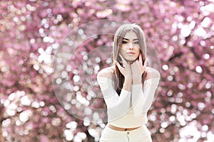 Fashion Art Beauty Portrait. Beautiful Girl in Fantasy Mystical and Magical Spring Garden. Model