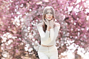 Fashion Art Beauty Portrait. Beautiful Girl in Fantasy Mystical and Magical Spring Garden. Model