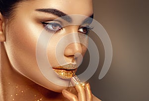 Fashion art golden skin woman face portrait