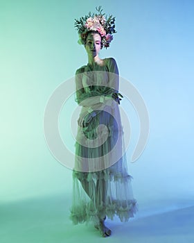 Fashion art photo of beautiful lady in flower diadem