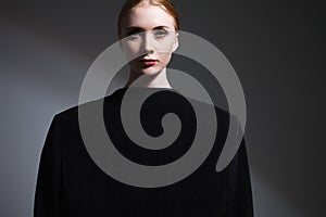 Fashion art studio portrait of elegant girl in geometric black a