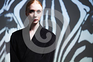 Fashion art studio portrait of elegant girl in geometric black a