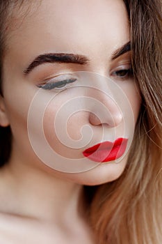 Fashion art studio portrait of elegant woman with red lips
