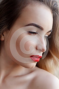 Fashion art studio portrait of elegant woman with red lips