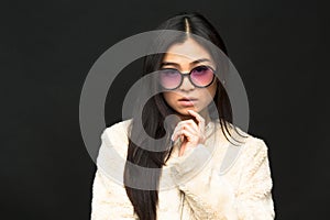 Fashion asian model woman in sunglasses in studio