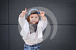 Fashion baby girl hip hop.a little girl in a baseball cap.