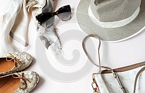 Fashion background. Female accessories in beige pastel colors