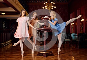 Fashion ballerinas in colourful dresses want to taste a sweet meringue and zephyr