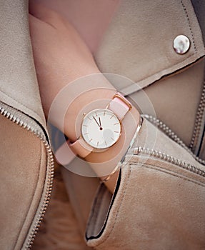 Fashion beautiful classic white watch on woman hand. Close-up photo