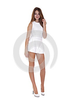 Fashion beautiful girl with modern white dress posing in studio