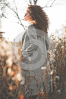 Fashion beautiful lady in autumn landscape