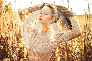 Fashion beautiful lady in autumn landscape